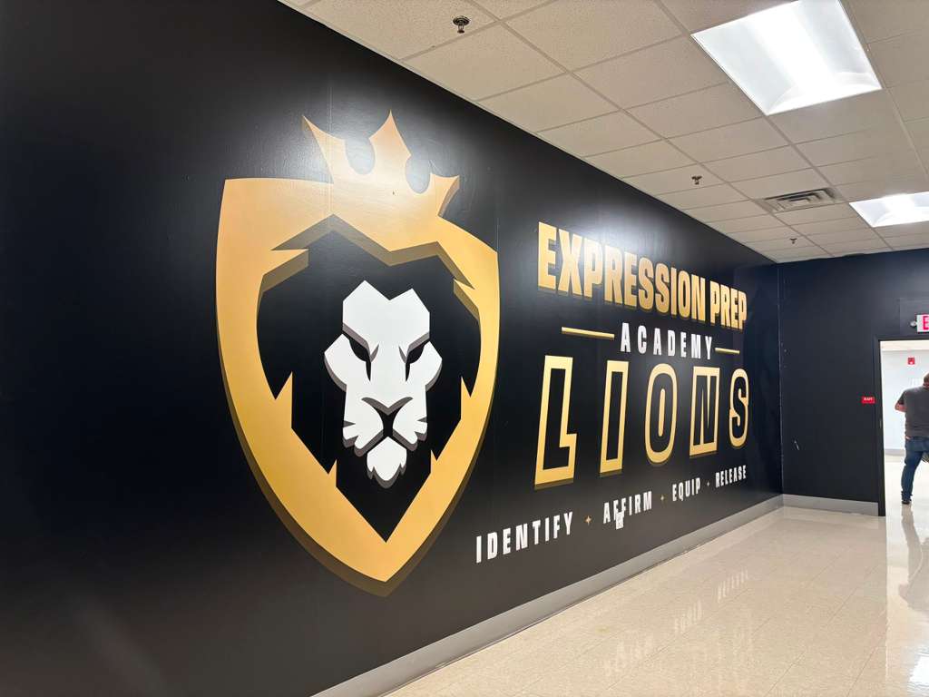 Lions mascot wall mural in a school hallway