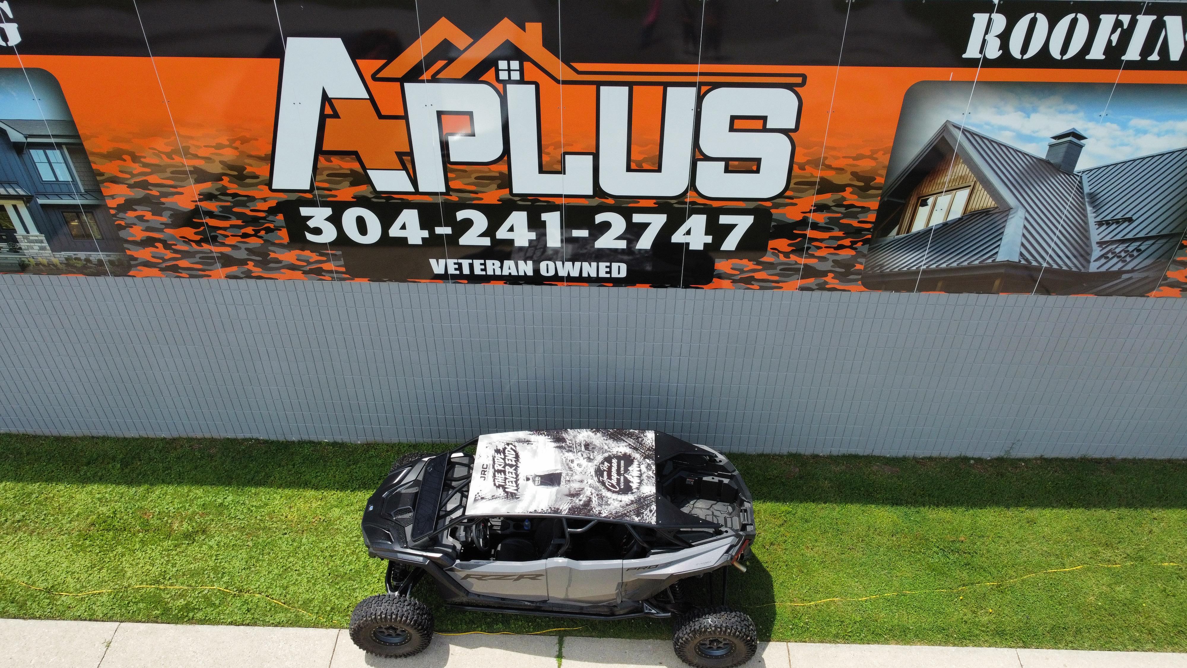 Custom roof-panel wrap on a Polaris RZR UTV, shot outside the shop