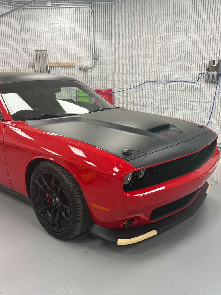 Matte black hood and roof wrap on a red Dodge Hellcat